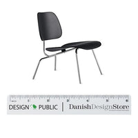 Black modern chair with a sleek design and chrome legs, featuring smooth, minimalist contours. Perfect for contemporary spaces.