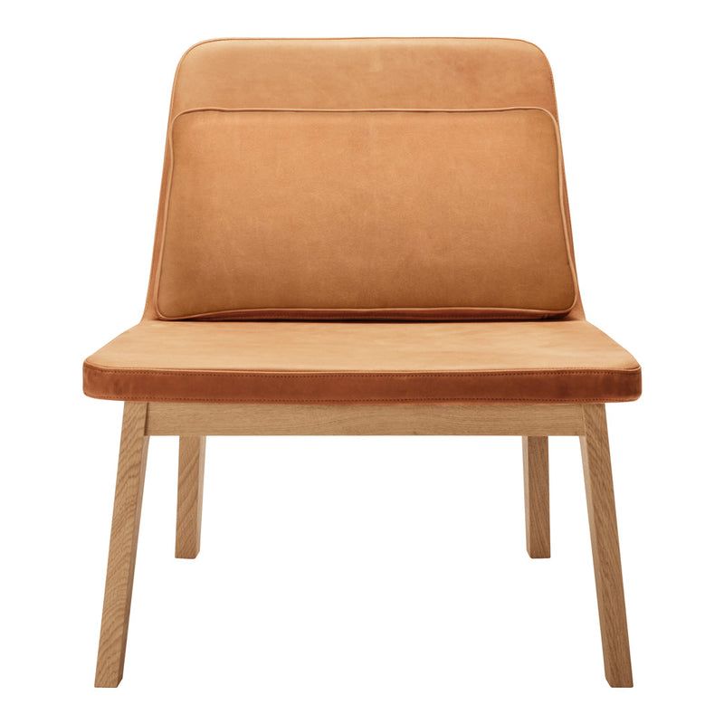 Tan suede chair with clean lines and a minimalist wooden base, perfect for modern decor.