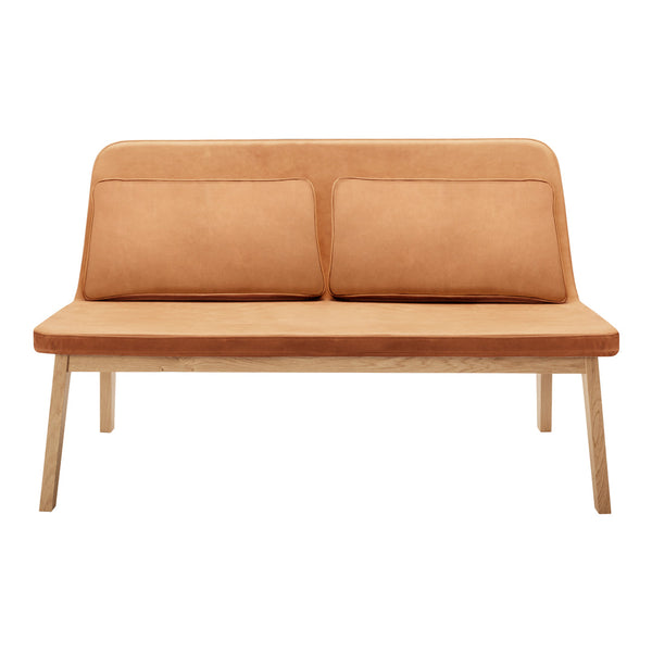 "Light brown suede loveseat with smooth texture and simple design, featuring two matching cushions."