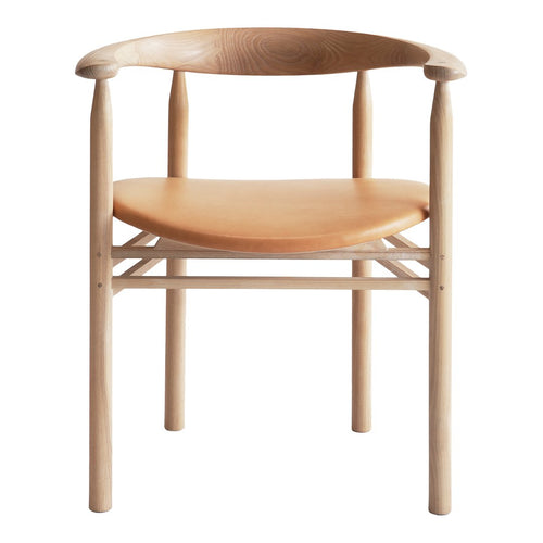 Light natural wood chair with a smooth, tan leather seat and minimalist design, featuring soft curves and clean lines.