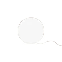 White circular lamp with a sleek design and minimalistic style, featuring a thin silver trim and a white cord.