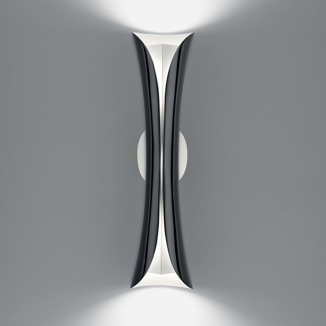 "Modern wall light in sleek black and white design, featuring graceful curves and a minimalistic pattern."