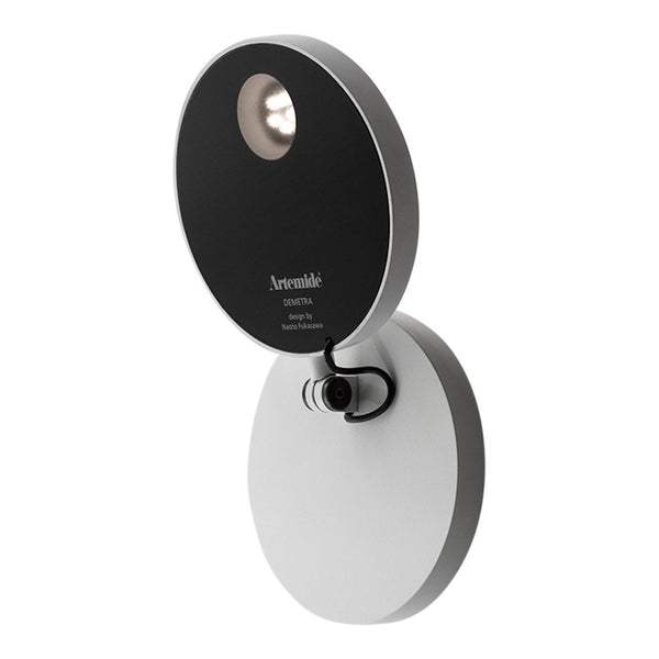 "Modern round wall lamp with sleek black and white design, featuring a smooth, matte finish and minimalist style."