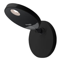 Sleek black wall lamp with a round base and modern accent light design. Minimalistic style perfect for contemporary decor.