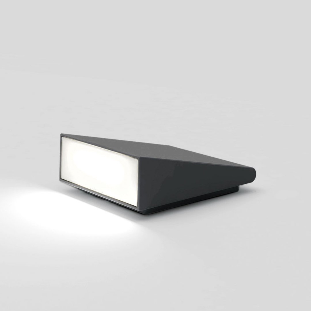 Sleek black modern lamp with a geometric design and white light panel, perfect for contemporary decor.