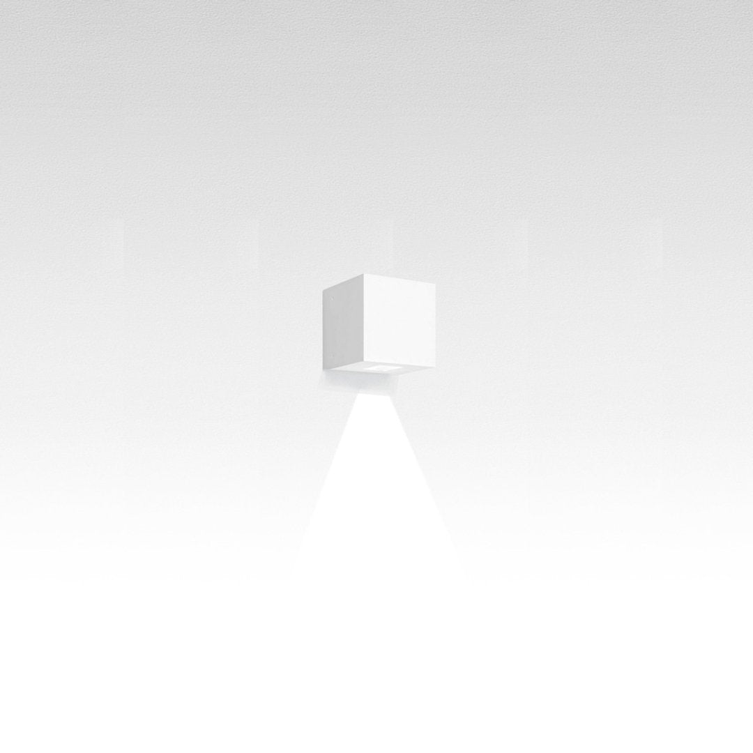 Minimalist white cube with smooth edges, casting a subtle shadow against a soft, gradient background.