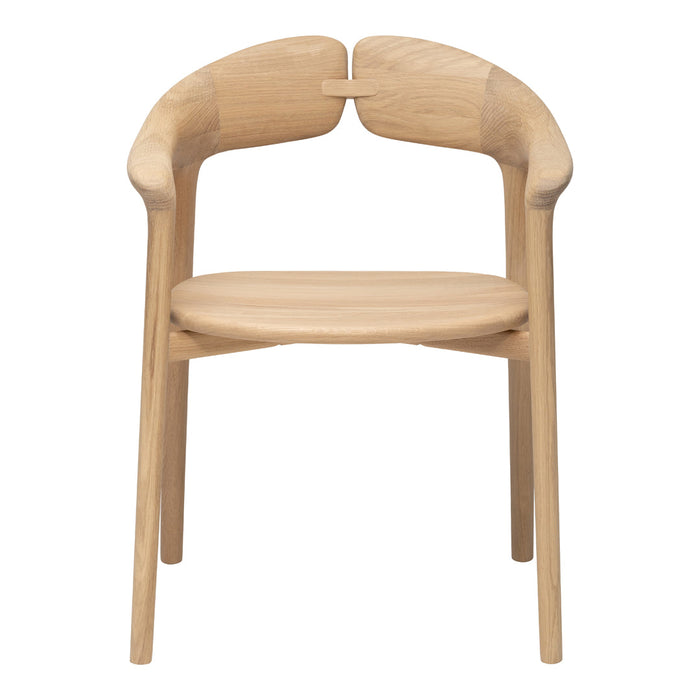 Natural wood chair with a smooth, light oak finish and minimalist design featuring seamless curves and soft edges.