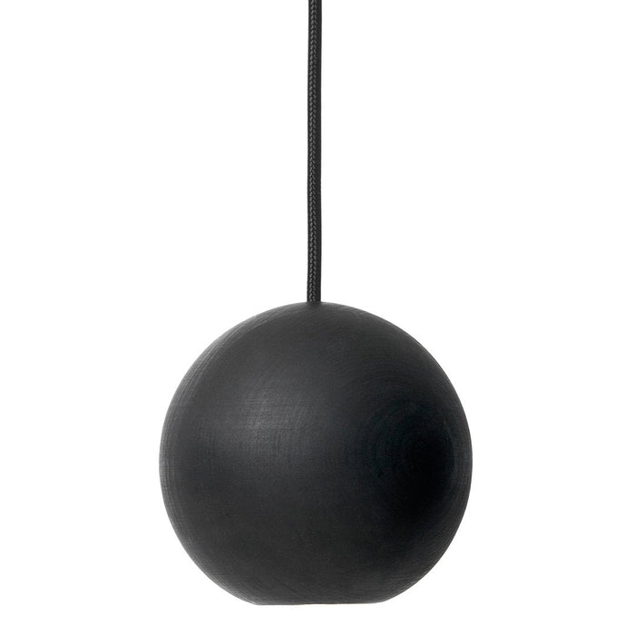 Matte black spherical pendant light with a smooth surface and minimalistic design. Ideal for modern interiors.