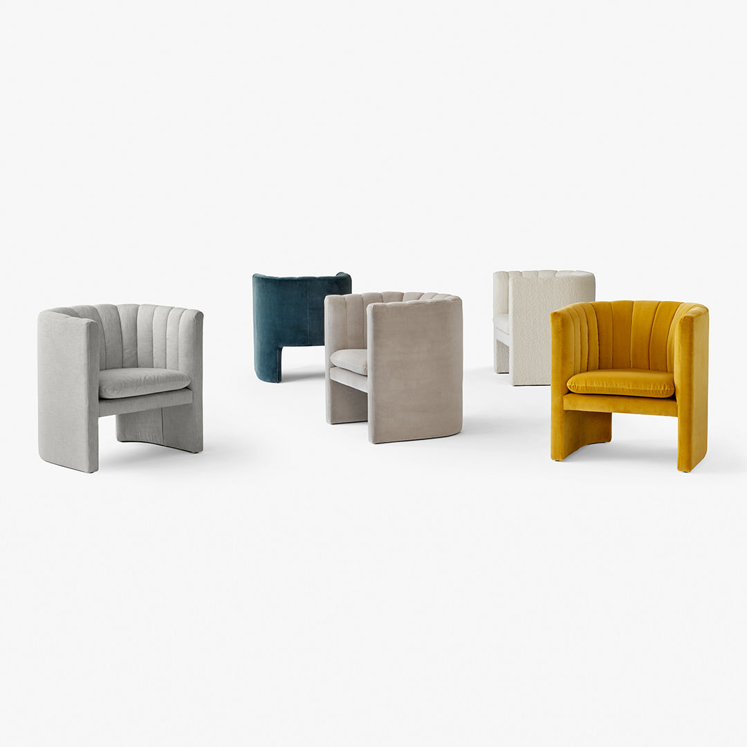 Set of modern accent chairs featuring soft gray, teal, beige, and vibrant yellow hues with a textured ribbed pattern.