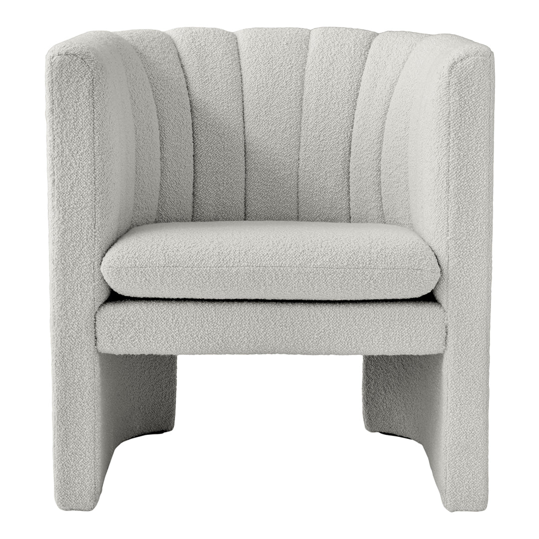 Textured gray chair with a modern striped pattern, showcasing a soft, cozy aesthetic perfect for contemporary decor.