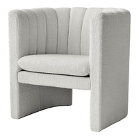 Textured white accent chair with curved lines and a plush, cozy design. Perfect for modern decor.