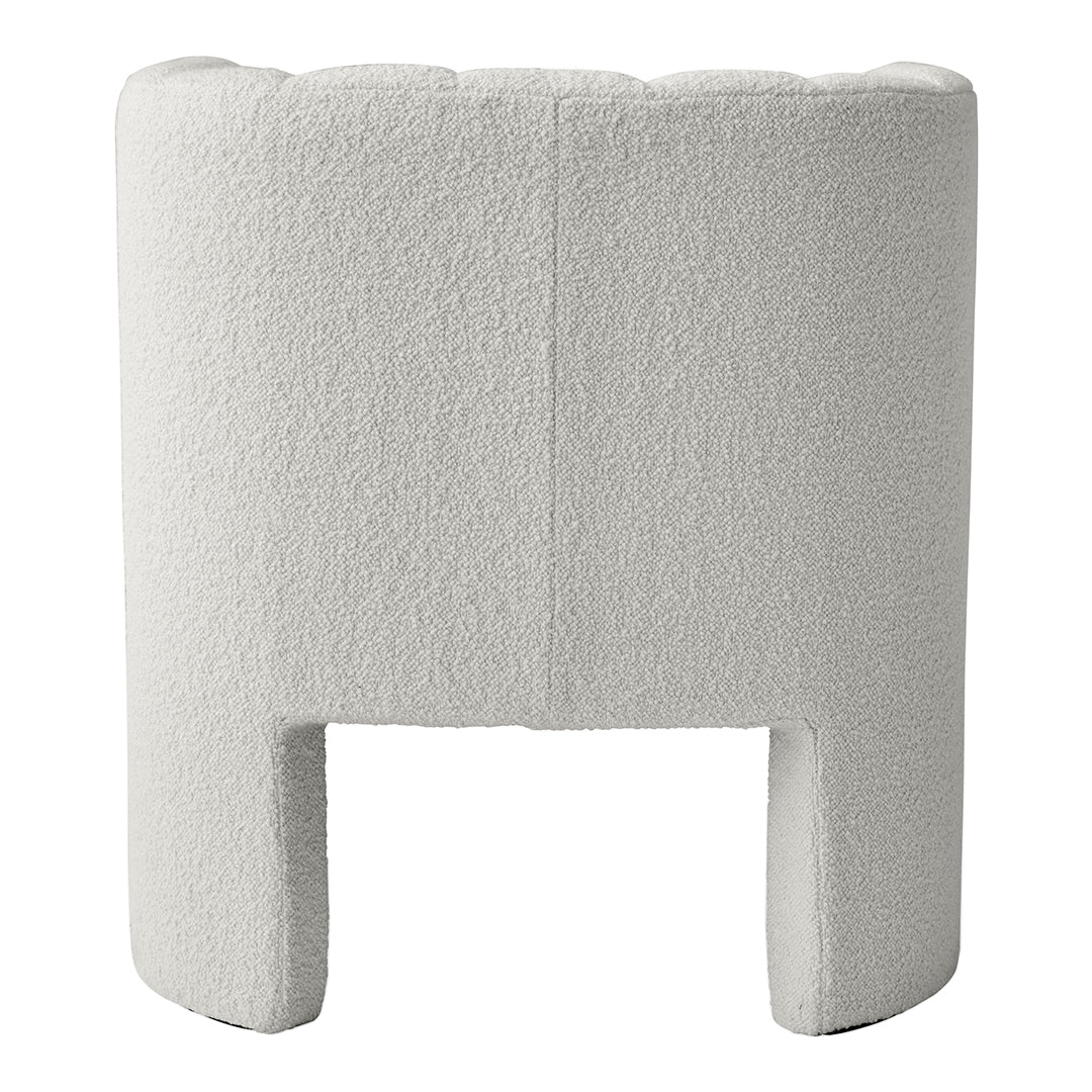 Textured white upholstered chair with a modern, minimalist design, featuring soft curves and a cozy appearance.