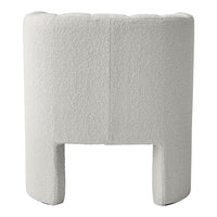 Textured white upholstered chair with a modern, minimalist design, featuring soft curves and a cozy appearance.