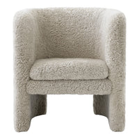 Cozy beige boucle accent chair with plush, textured fabric and a rounded design for modern interiors.