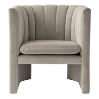 Beige velvet accent chair with vertical channel tufting and a modern, minimalist design.