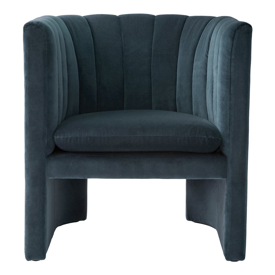 Plush teal velvet accent chair with vertical ribbed texture, modern design, and sleek silhouette. Perfect for contemporary decor.