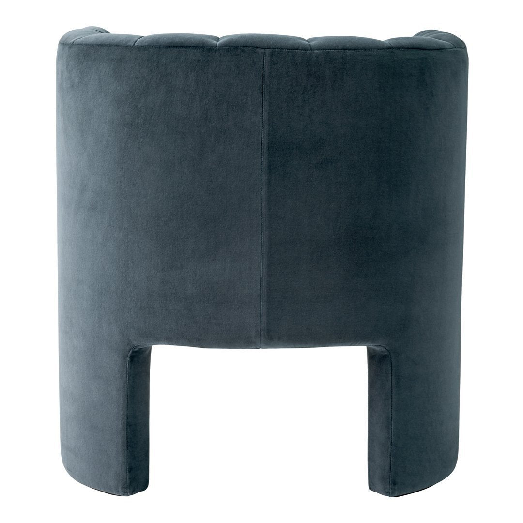 Gray velvet accent chair with a sleek, modern design and unique cut-out legs, featuring a smooth, textured finish.