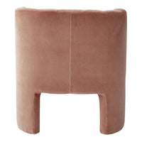 "Soft blush pink upholstered chair with a smooth velvet texture and minimalist design."