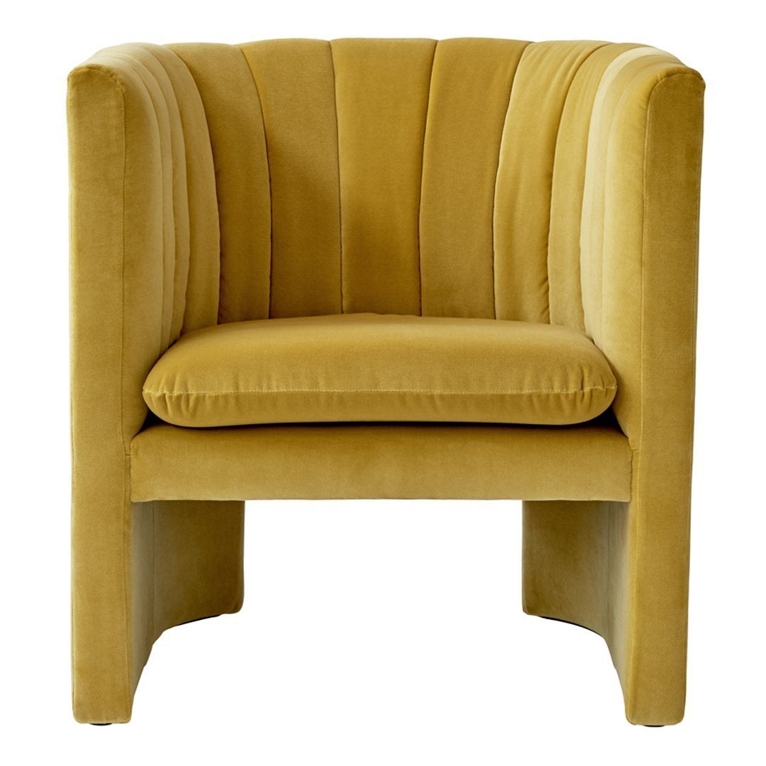 Velvet yellow accent chair with ribbed texture and modern design, adding a pop of color to any room.