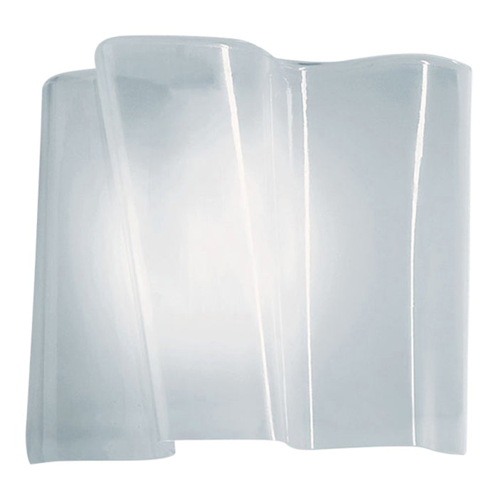 "Elegant clear glass wall sconce with flowing pattern and soft illumination, perfect for modern decor."
