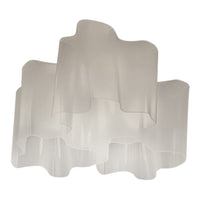 Translucent white layered lamp with a wavy pattern, adding a modern touch to any space.