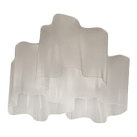 Translucent white lamp shade with smooth, wavy edges and layered design for a modern, airy look.