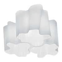 White wavy lampshade with a smooth, glossy finish, featuring a modern, elegant design. Perfect for contemporary decor.