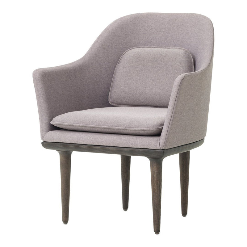 Soft lavender armchair with a minimalist design and subtle texture, featuring wooden legs and a stylish silhouette.