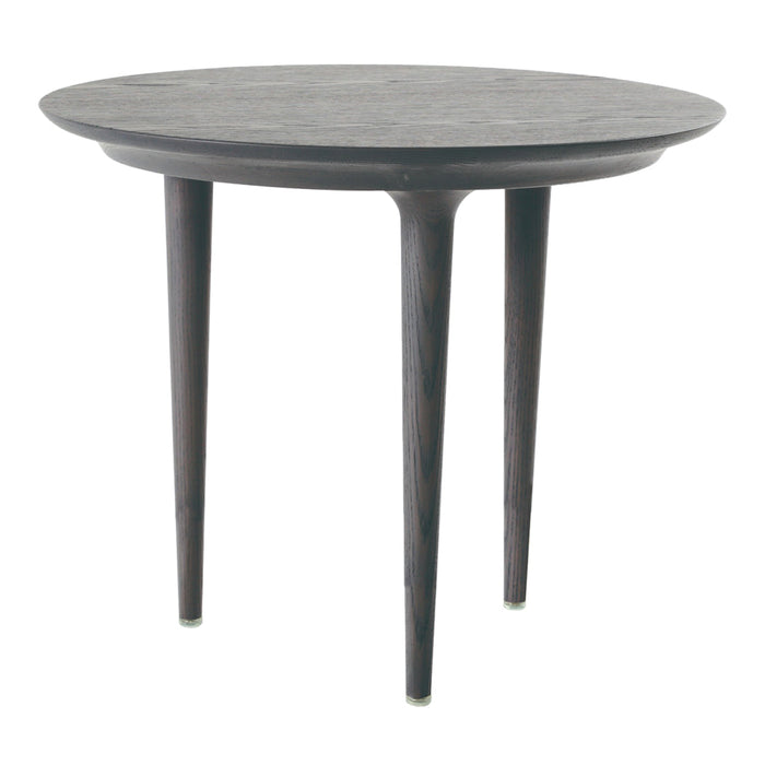 Dark round table with a smooth, patterned top and tapered wooden legs, adding a modern touch to any space.