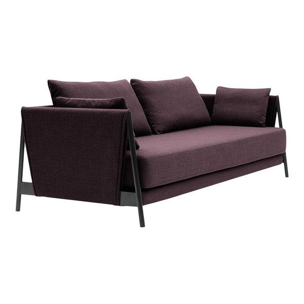 Modern purple sofa with a sleek design, featuring soft, textured upholstery and minimalist black metal accents.