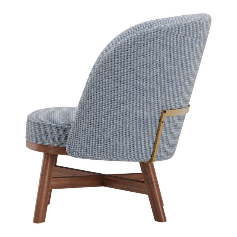 Blue patterned upholstery with a textured weave on a mid-century style chair, featuring a warm wood base.