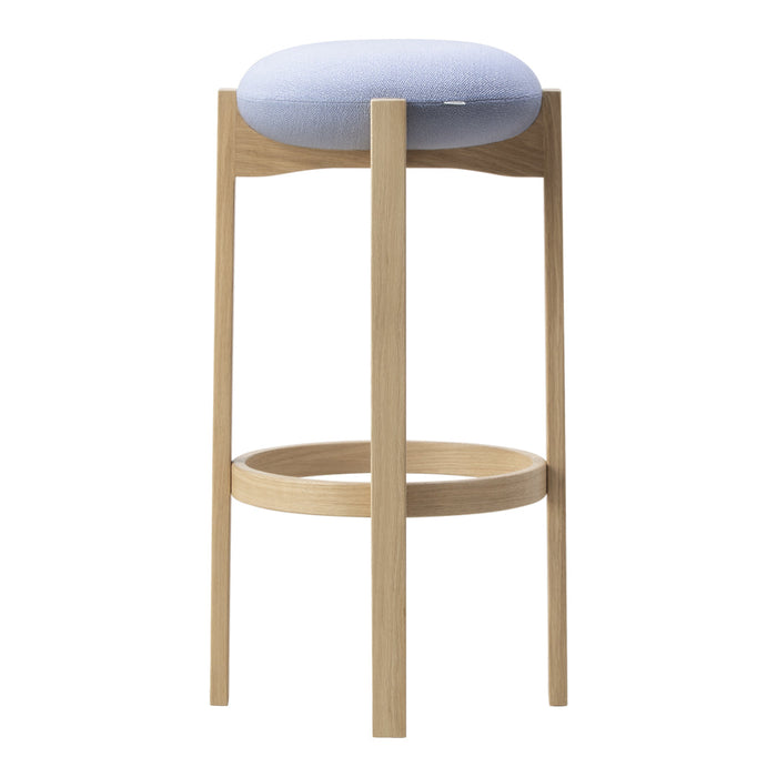 Light blue upholstered seat on natural wood bar stool with minimalist design and no patterns.