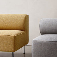 "Modern yellow and gray upholstered chairs with textured patterns on minimalist black legs."