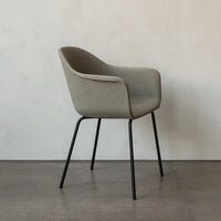Stylish gray upholstered chair with subtle striped texture and sleek black metal legs against a neutral background.