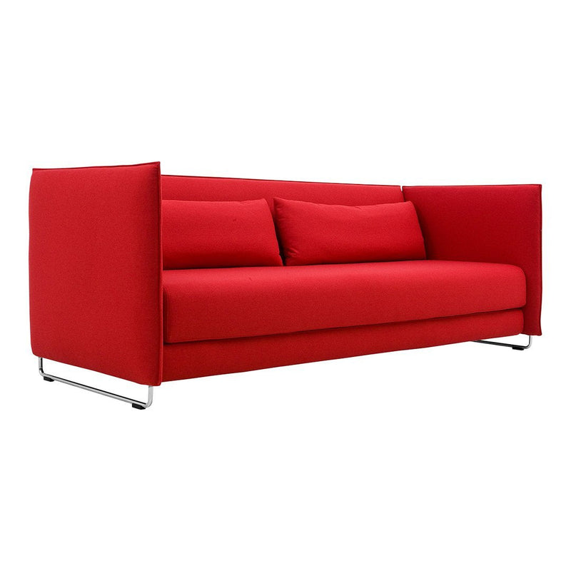 Vibrant red sofa with clean lines and smooth fabric, featuring minimalist design and no visible pattern.
