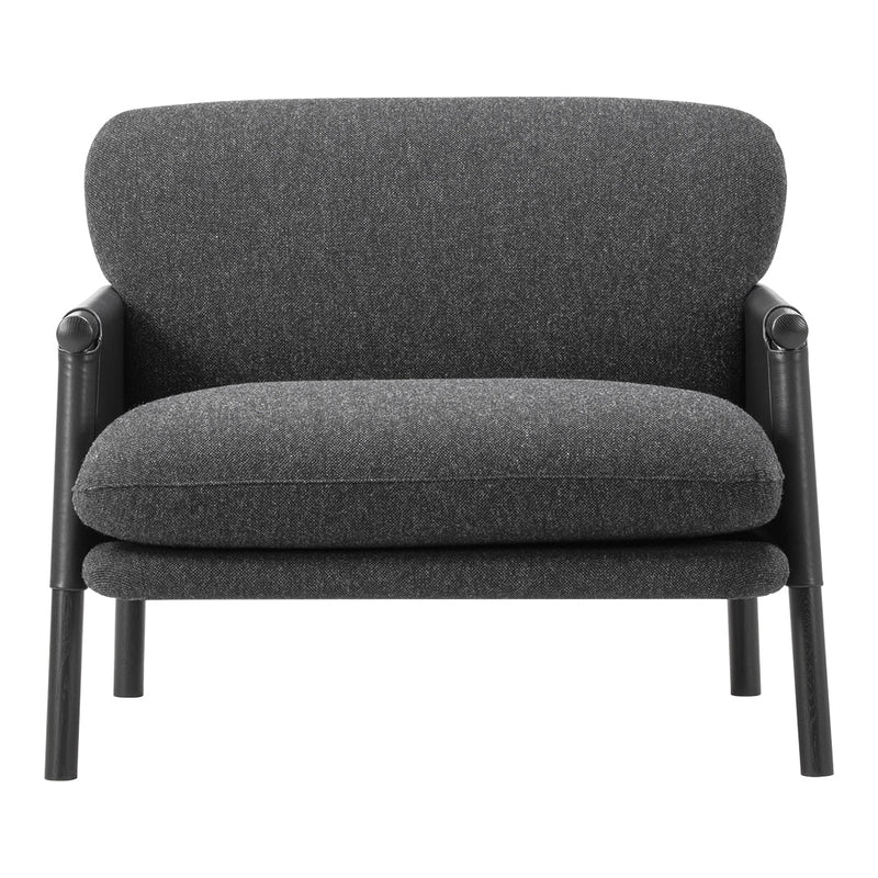Gray upholstered chair with a smooth texture and minimalist design, featuring a solid black frame for contrast.