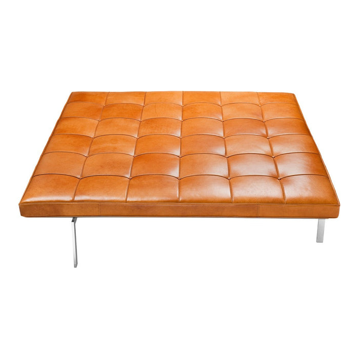 Brown tufted leather sofa with square design and shiny metal legs. Modern and stylish furniture for contemporary spaces.