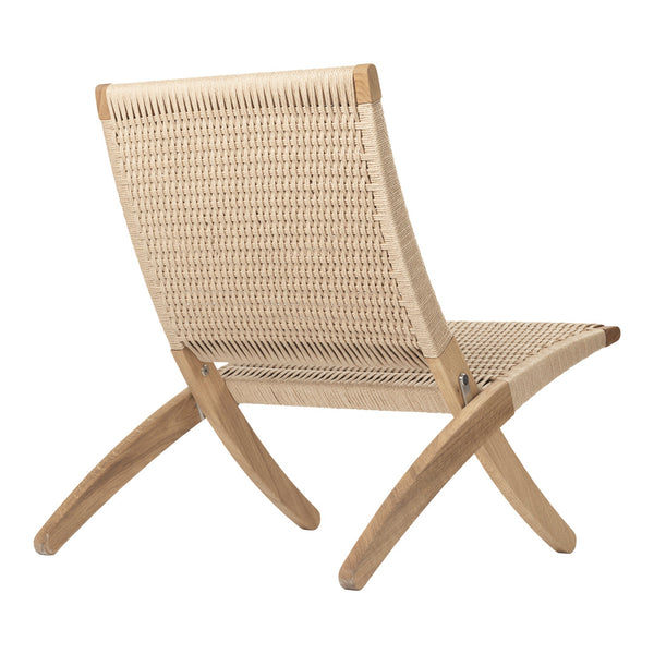 Natural beige woven fabric chair with light wooden legs, showcasing a minimalist design and elegant texture.