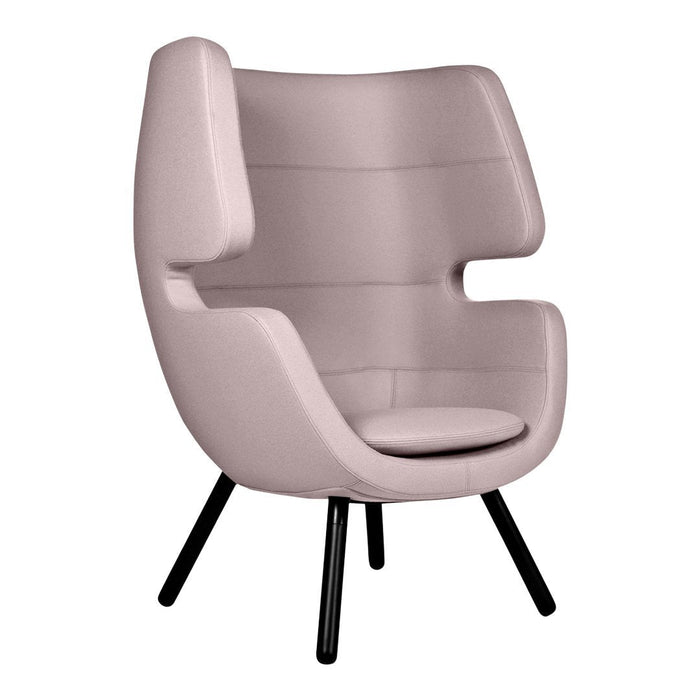 Soft pink accent chair with a modern design and smooth, sleek lines. Features a simple black base for contrast.