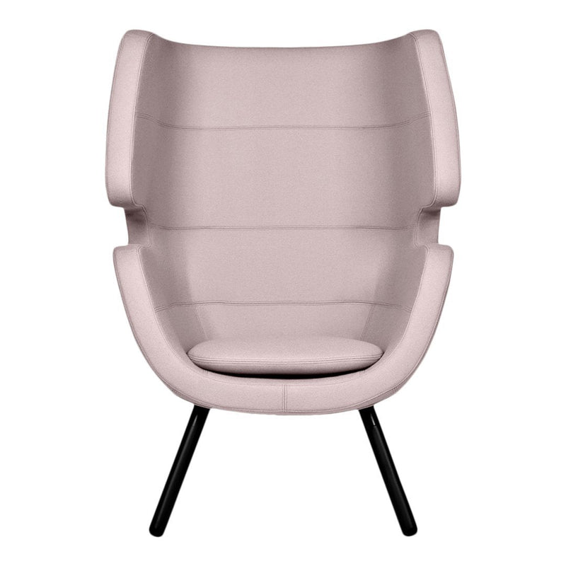Soft pink upholstered chair with minimalistic design and smooth patterns, complemented by sleek black legs.
