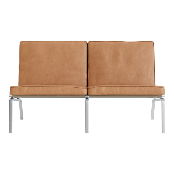 Tan leather loveseat with smooth texture and sleek chrome legs, minimalist design for modern interiors.