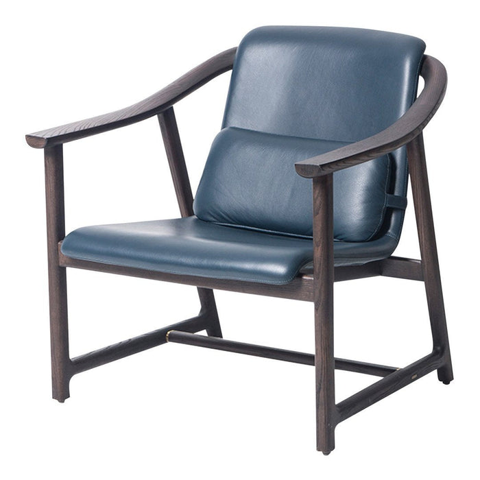 Blue leather armchair with a sleek design and dark wooden frame, showcasing a minimalistic and modern aesthetic.