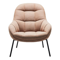 Soft peach upholstery with tufted pattern, complemented by sleek black metal legs. Perfect for cozy modern spaces.