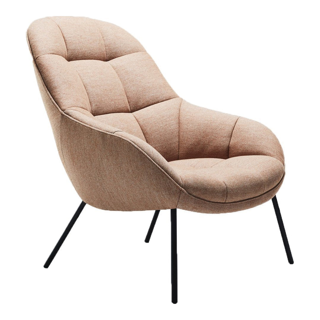 Peach-hued lounge chair with tufted upholstery and sleek black metal legs, adding a modern touch to any space.