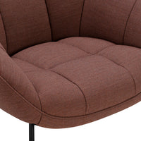Brown upholstered armchair with tufted design and sleek black metal legs. Ideal for modern interiors.