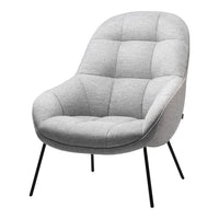 Gray tufted armchair with a smooth, modern design and black metal legs, perfect for contemporary decor.
