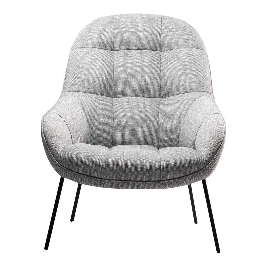 Light gray upholstered chair with a quilted pattern and black metal legs, perfect for modern decor.