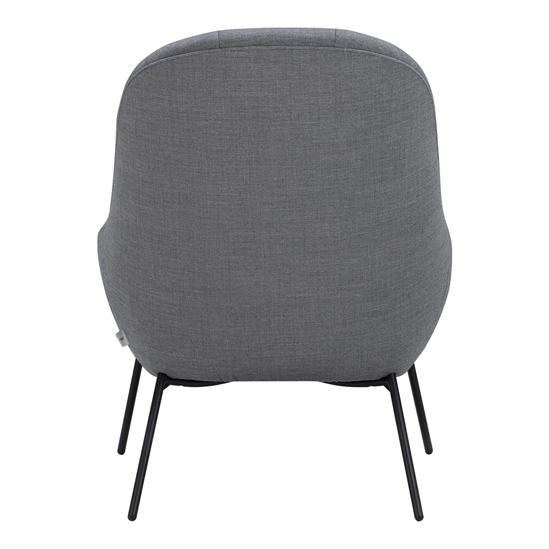 Gray upholstered chair with a smooth texture and sleek black metal legs. Minimalist design for modern interiors.