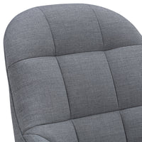 Gray upholstered chair with a modern quilted pattern and smooth, rounded edges. Ideal for contemporary interiors.