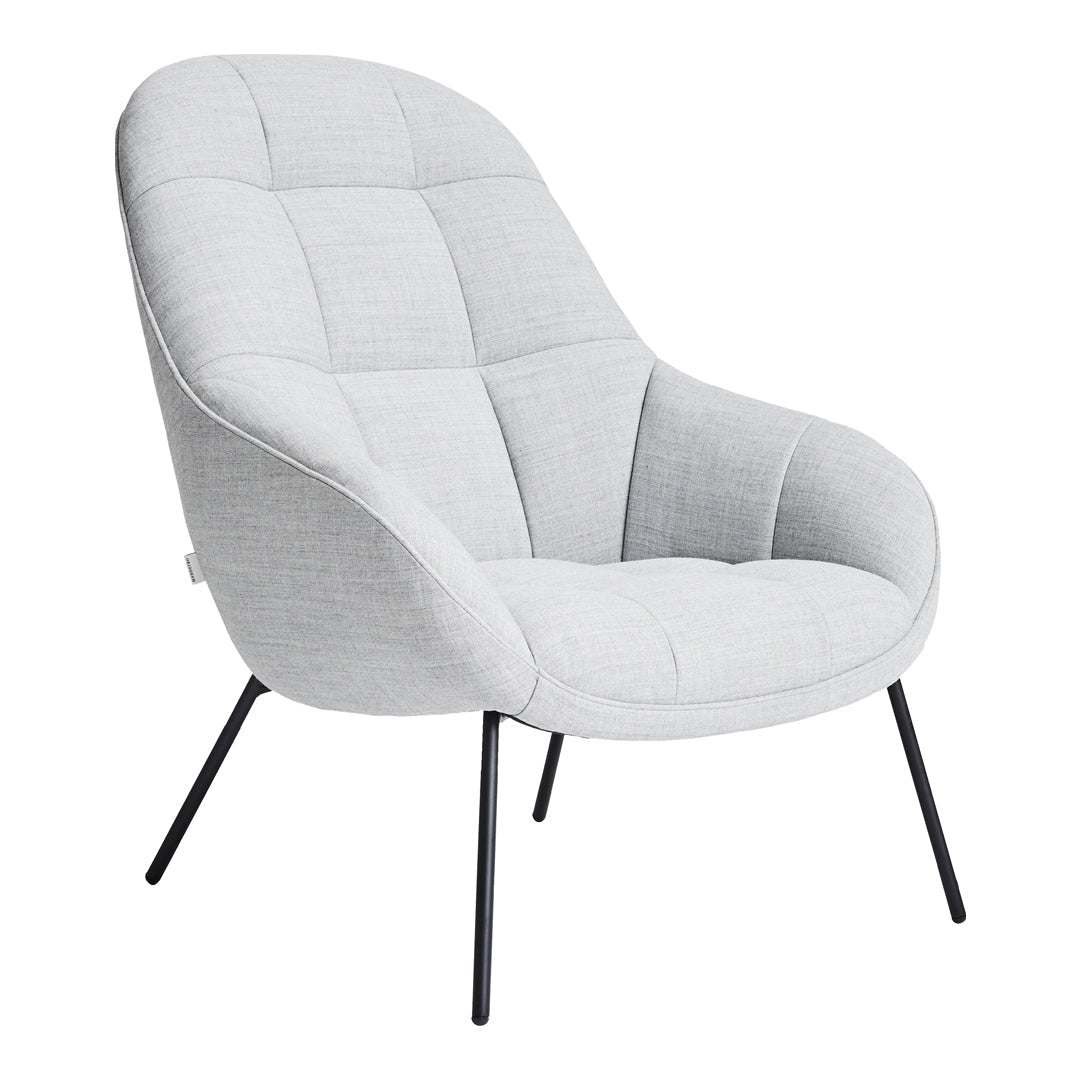 Light gray upholstered chair with subtle quilted pattern and sleek black metal legs, perfect for modern decor.